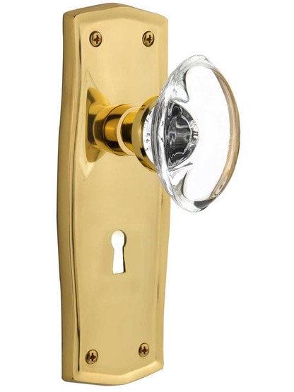 Prairie Style Door Set with Oval Crystal Glass Knobs in Un-Lacquered Brass .